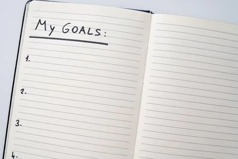 Blank page of diary with text "my goals". Stock Photos