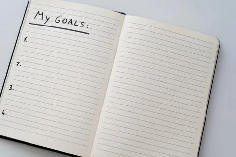 Blank page of diary with text "my goals". Stock Photos