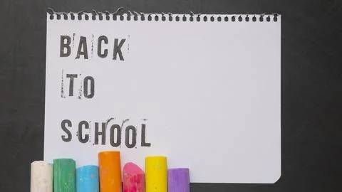 Blank page of a notebook with the phrase "Back To School" written in English  Stock Photos