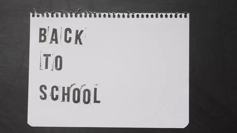 Blank page of a notebook with the phrase "Back To School" written in English  Stock Photos