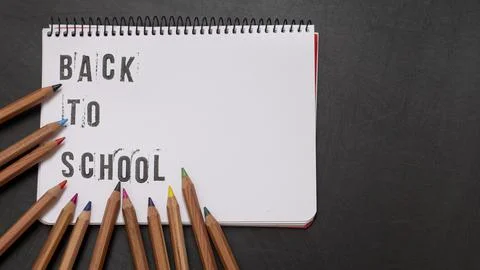 Blank page of a notebook with the phrase "Back To School" written in English  Stock Photos