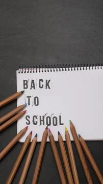 Blank page of a notebook with the phrase "Back To School" written in English  Stock Photos