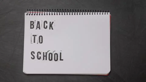 Blank page of a notebook with the phrase "Back To School" written in English  Stock Photos