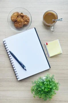 Blank paper and office tools on the wood table - top view Stock Photos