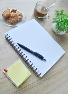 Blank paper and office tools on the wood table Stock Photos