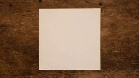 Blank Paper Background. Unwrapping and wrapping square blank paper. Stock Footage 95053751