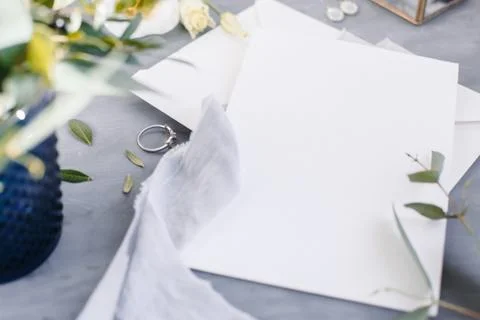 Blank paper copy space. Frame with flowers. Silk ribbon. Gray background. Sim Stock Photos