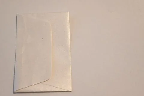 Blank paper envelope on a light surface Stock Photos