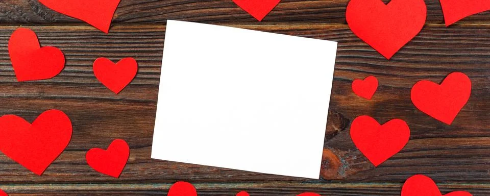 Blank paper note with red heart shape on grunge wooden background Stock Photos
