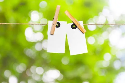 Blank paper notes with copy space pinned on rope Stock Photos