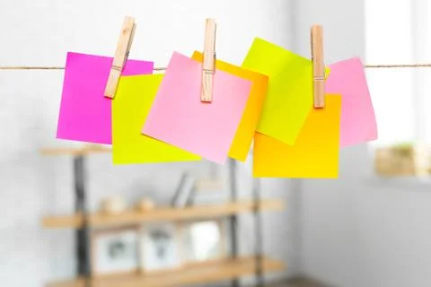 Blank paper notes with copy space pinned on rope Stock Photos