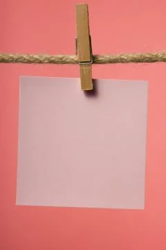 Blank paper notes hanging on rope with clothes pins, copy space Stock Photos