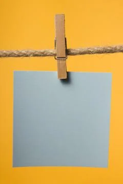 Blank paper notes hanging on rope with clothes pins, copy space Stock Photos