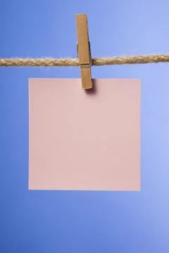 Blank paper notes hanging on rope with clothes pins, copy space Stock Photos