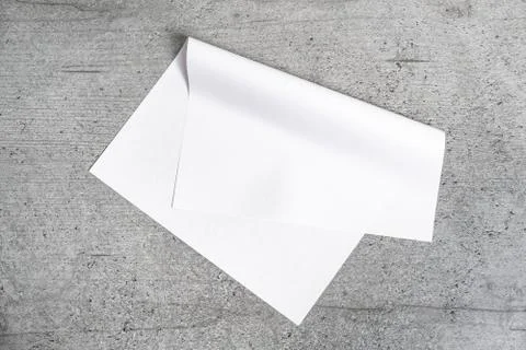 Blank paper sheet on grey background.  Fotos Stock