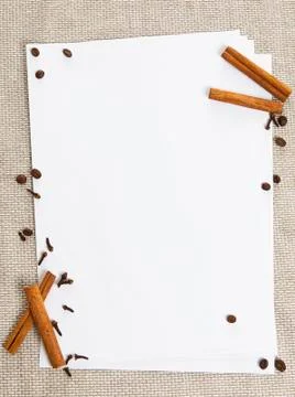 Blank paper on the table textile background with cinnamon Stock Photos