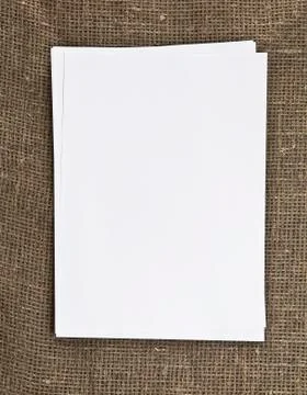 Blank paper on the table textile background Stock Photos