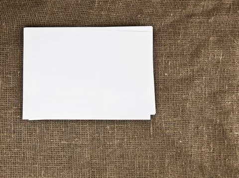 Blank paper on the table textile background Stock Photos