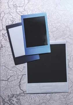 Blank photo frames on map background as template. Top View of photo frame on map Photos