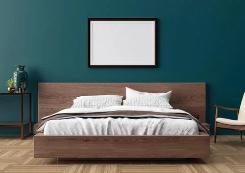 Blank picture frame on blue wall in bedroom. Mock up poster frame in modern i Stock Photos