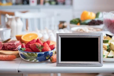 Blank picture frame with fruit, vegetable and meat for lunch Stock Photos