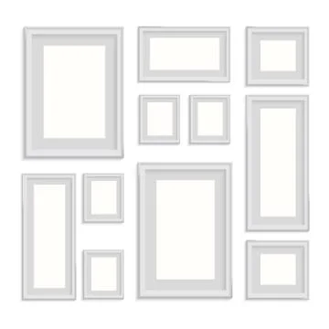Blank picture frame template set isolated on wall Illustrazione stock