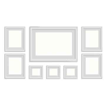 Blank picture frame template set isolated on wall Illustrazione stock