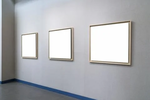 Blank picture frames on exhibition wall Stock Photos