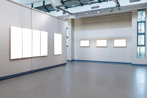 Blank picture frames on exhibition wall Stock Photos