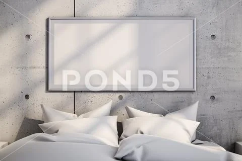 Blank picture hanging on concrete wall over soft bed in modern bedroom at hom Template PSD