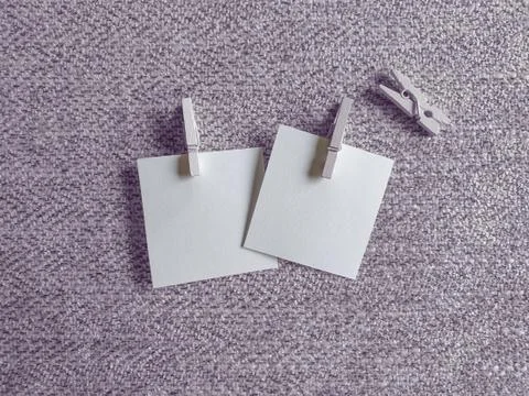 A Blank Pieces of Note Papers and Wood Clothespins on the Cloth Stock Photos