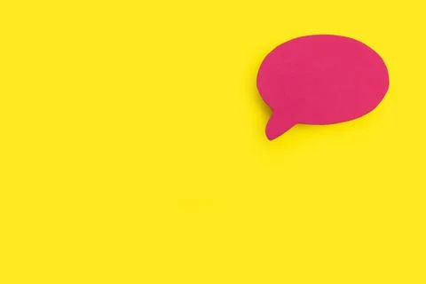 Blank pink speech bubble on a yellow background with copy space Stock Photos
