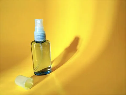 Blank plastic bottle with sprayer cap on yellow Stock Photos