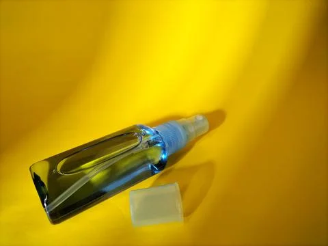 Blank plastic bottle with sprayer cap on yellow Stock Photos