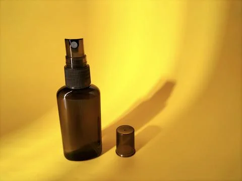 Blank plastic bottle with sprayer cap on yellow Stock Photos