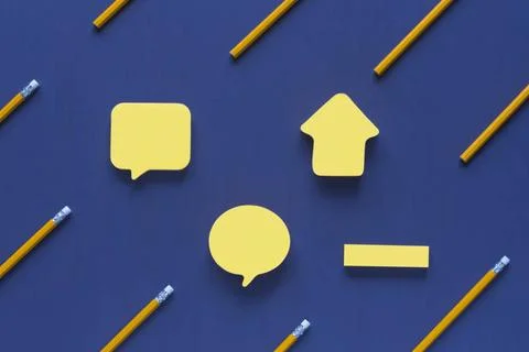 Blank post-it notes surrounded by pencils Yellow sticky notes in different... Stock Photos