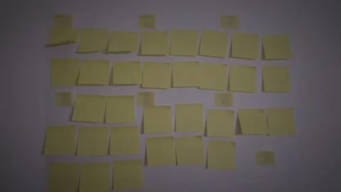 Blank post it on the wall. Empty post it notes. Stock Footage 153442586