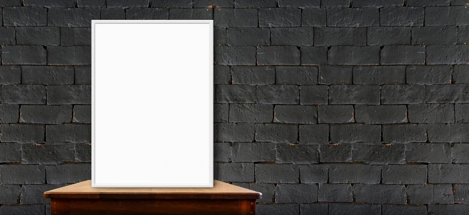 Blank poster on wood table at black brick wall,perspective background Stock Photos