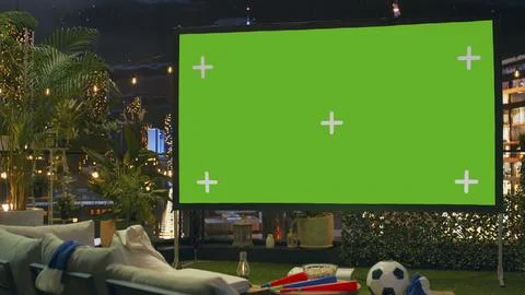 Blank projection screen mockup in rooftop lounge prepared for football match Stock Photos
