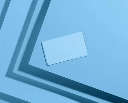 Blank rectangular business card on creative blue background from sheets of... 스톡 사진