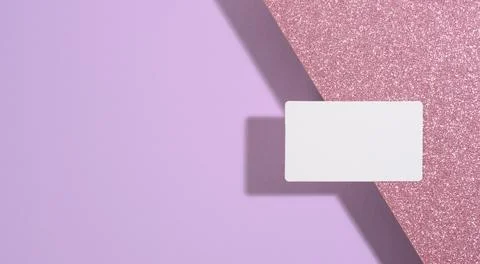 Blank rectangular business card lies on a modern purple background sheets of  Stock Photos