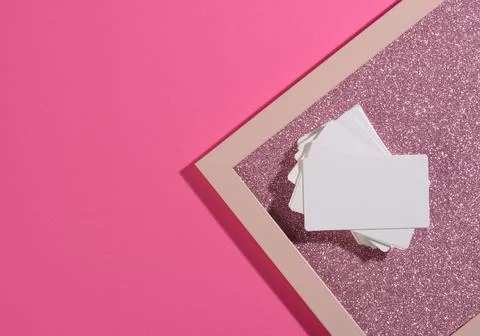 Blank rectangular business card lies on a modern pink background sheets of pa 스톡 사진