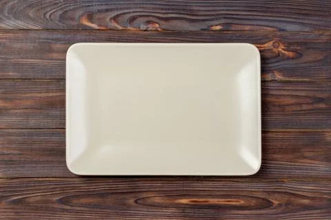 Blank rectangular plate on wooden background. top view Stock Photos