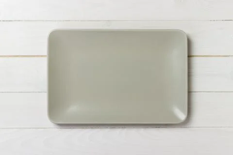 Blank rectangular plate on wooden background. top view Stock Photos