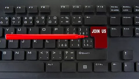 Blank red enter key of computer keyboard. Join us concept Stock Photos