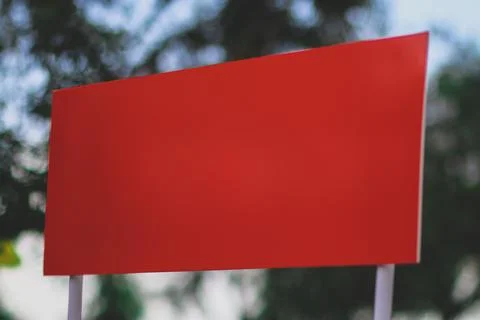 Blank red rectangular sign against green background Stock Photos