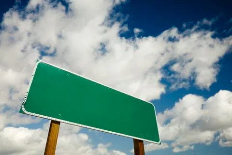 Blank Road Sign with dramatic clouds and sky ready for your own copy. Stock Photos