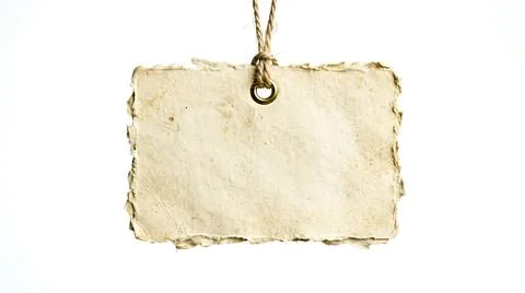 Blank rustic paper tag with torn edges hanging on a string isolated on whit.. Stock Photos