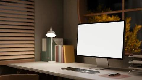 Blank screen computer aside file folder and lamp on wooden table in a dim l.. 스톡 일러스트