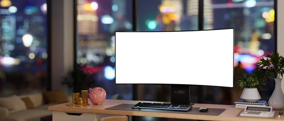 Blank screen computer with calculator, gold coins and piggy bank on table i.. Illustrazione stock
